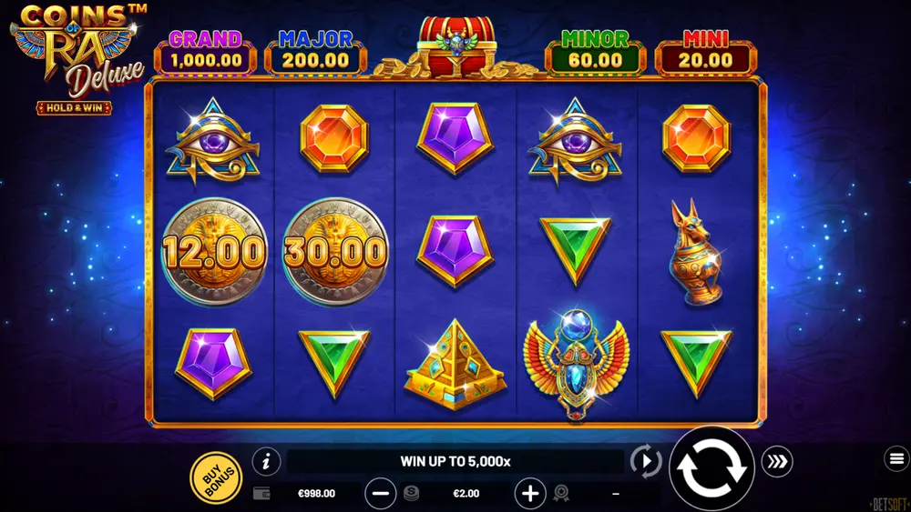 Coins of Ra Deluxe Hold and Win base game grid with Winged Scarab and Golden Pyramid symbols
